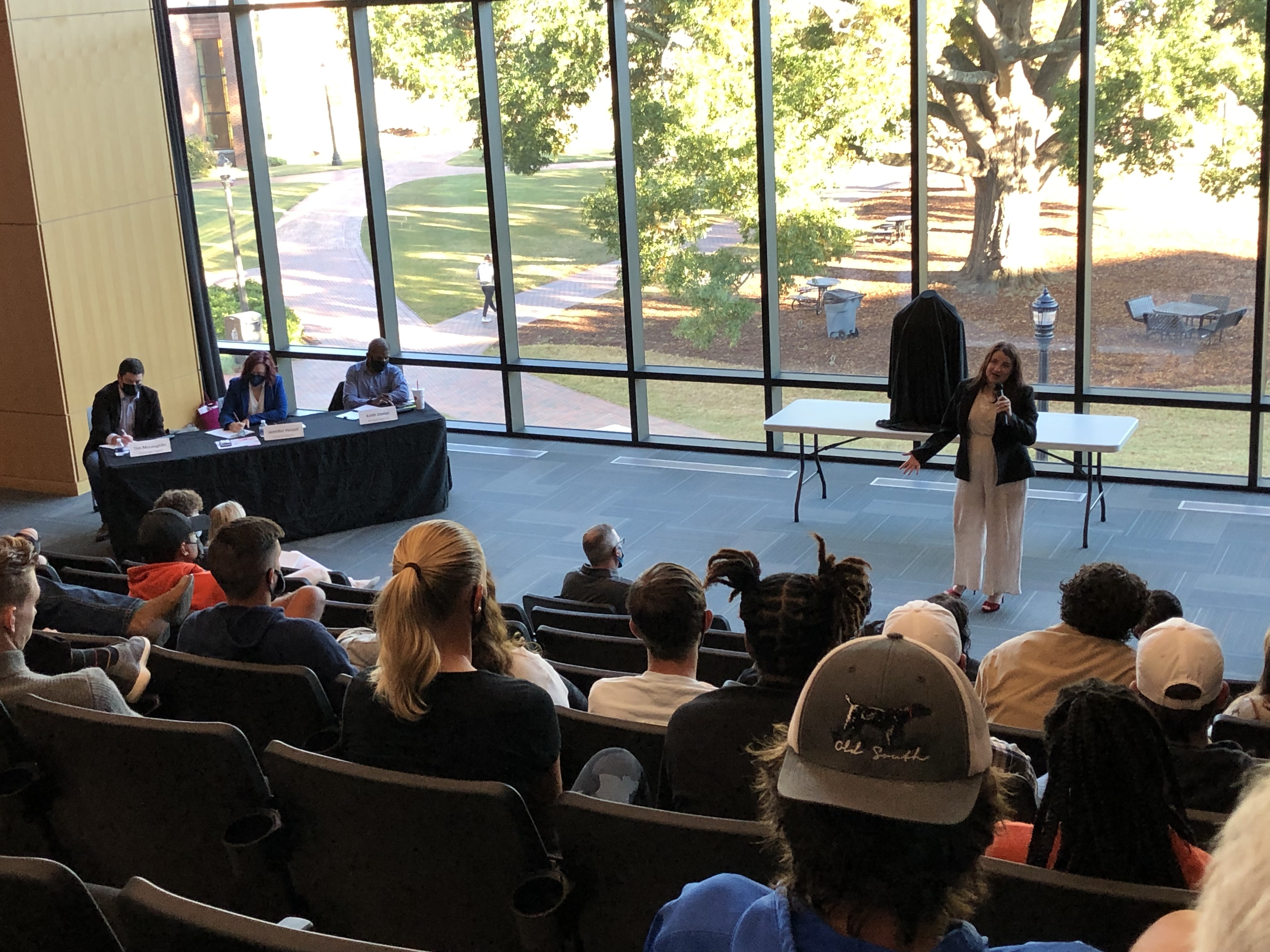 Student pitching their AI startup idea to judges and audience